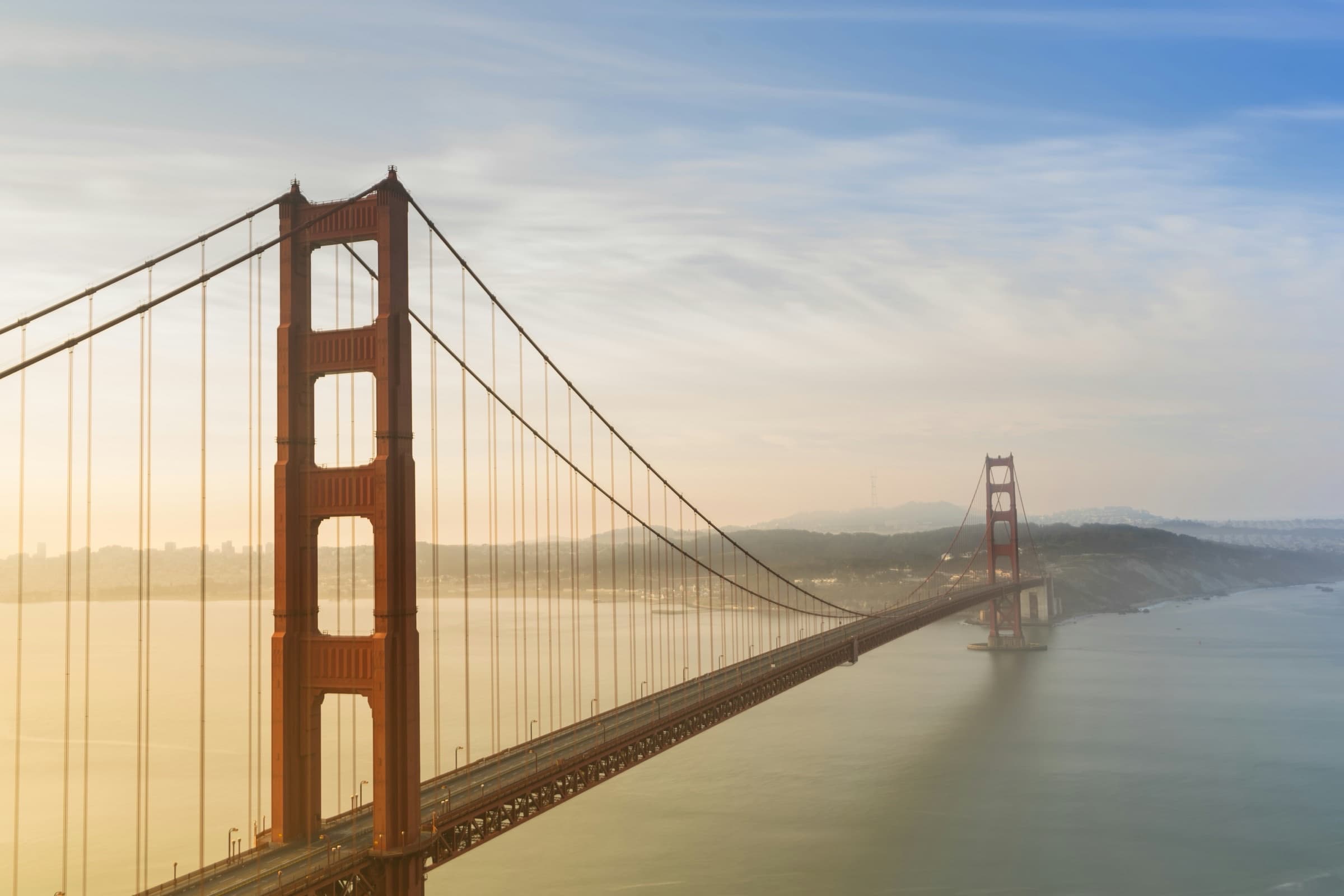 Golden Gate Bridge emerging from soft morning mist, San Francisco Bay